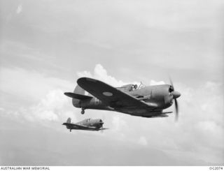 IN FLIGHT OVER BOUGAINVILLE ISLAND, SOLOMON ISLANDS. 1945-01-17. ACTING AS PATHFINDERS TO LOCATE AND MARK TARGETS, TWO AUSTRALIAN BUILT BOOMERANG AIRCRAFT OF NO. 5 (ARMY CO-OPERATION) SQUADRON RAAF ..