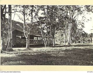 LAE, NEW GUINEA. 1944-03-25. ONE OF ADJOINING PHOTOGRAPHS SHOWING THE OFFICERS' MESS, OFFICERS' QUARTERS AND QUARTERS UNDER CONSTRUCTION AT HEADQUARTERS LAE BASE SUB-AREA. THE RECREATION GROUND IS ..