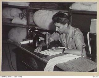 BOUGAINVILLE, 1945-04-19. PRIVATE H. PEERS, AUSTRALIAN ARMY MEDICAL WOMEN'S SERVICE, HOSPITAL SEAMSTRESS, 2/1 GENERAL HOSPITAL, AT WORK