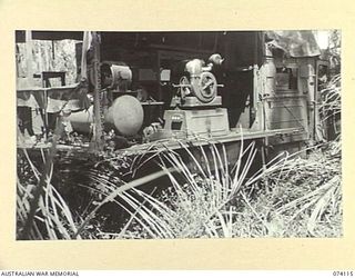 HANSA BAY, NEW GUINEA. 1944-06-17. A JAPANESE MOBILE LIGHTING SET, COMPLETE WITH GENERATOR, ABANDONED BY THE ENEMY DURING THEIR RETREAT IN THE AREA