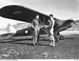 A Piper L-4 Grasshopper aircraft of 4 Squadron RAAF, used by the officers of the 7th Australian division for reconnaissance work and for visiting forward units in the valley. Identified from the ..