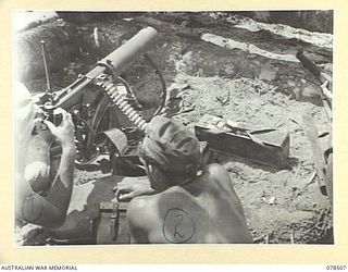 BOUGAINVILLE ISLAND, 1945-01-16. QX48675 PRIVATE G. MCCLUTCHEON (1) AND QX41468 PRIVATE F.P. KNIGHT (2) A VICKERS GUN CREW OF "D" COMPANY, 47TH INFANTRY BATTALION SUPPORTING THE INFANTRY DURING THE ..