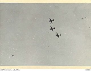 FARIA RIVER, NEW GUINEA. 1944-01-20. MITCHELL BOMBERS MOVING INTO ATTACK JAPANESE POSITIONS ACROSS MAIN CREEK