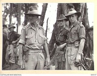 WEWAK AREA, NEW GUINEA, 1945-06-29. BRIG L.E.S. BARKER, BRIGADIER ROYAL ARTILLERY FIRST ARMY (1), MAJ E.N. ROBINSON, SURVEY BATTERY, ROYAL AUSTRALIAN ARTILLERY (2) AND MAJ R.J. WISE, COMD ROYAL ..