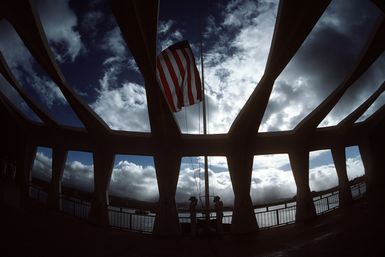The American flag is raised at the USS ARIZONA Memorial