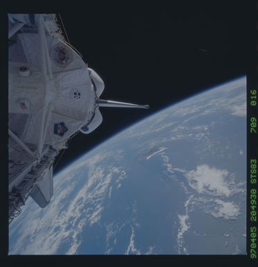 STS083-709-016 - STS-083 - View of Spacelab module in payload bay with Earth background