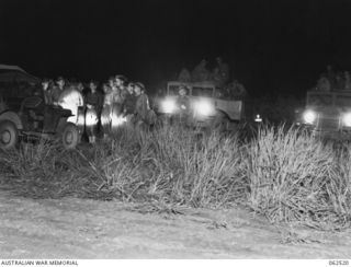 WARD'S DROME, PORT MORESBY AREA, PAPUA, NEW GUINEA. 1944-01-06. TROOPS OF THE 15TH AUSTRALIAN INFANTRY BRIGADE, JUST ARRIVED AT WARD'S DROME FROM THE MAIN MARSHALLING AREAS, RECEIVING FINAL ..