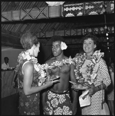 Miss Maglia, on right, and unidentified woman speaking with Fijian man, Suva, Fiji, 22 February 1966 [1] John Mulligan