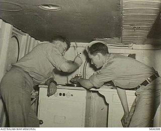 Dutch New Guinea. 1944-09-21. Private Jack C. Church of 309 Van Dorn Street, Corbin, Kentucky, USA, one of the hundreds of GIs flown north from Port Moresby to Hollandia in Martin PBM Mariner ..