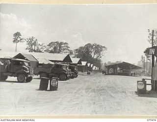 TOROKINA, BOUGAINVILLE ISLAND. 1944-12-04. A GENERAL VIEW OF HEADQUARTERS, 2ND BASE SUPPLY DEPOT TAKEN FROM THE ENTRANCE. THE DEPOT AT PRESENT CONSISTS OF 16 STORAGE SHEDS AND ONE TRANSIT SHED