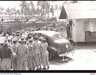 RABAUL, NEW BRITAIN, 1946-01-05. AFTER THEIR WEDDING RECEPTION HELD AT THE AUSTRALIAN ARMY MEDICAL WOMEN'S SERVICE (AAMWS) MESS, 118TH AUSTRALIAN GENERAL HOSPITAL, CORPORAL R. STANLEY, AUSTRALIAN ..