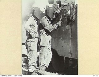 MADANG, NEW GUINEA. 1944. WELDERS OF THE 593RD UNITED STATES BARGE COMPANY REPAIR WORKSHOPS ARC WELDING A NEW PLATE INTO THE HULL OF AN AMPHIBIOUS "DUKW"