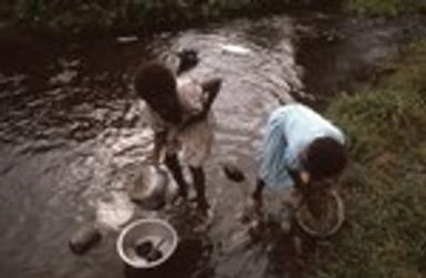 Young girls finish up dish washing