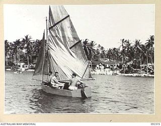 JACQUINOT BAY, NEW BRITAIN, 1945-05-20. MAKING LEEWAY AND BALLOONING TO CATCH WHAT LITTLE WIND THERE WAS, THE "ACEPOT", SAILED BY CAPTAIN R.D. DOUGLAS, HEADQUARTERS 5 DIVISION, COMES ABOUT AT THE ..