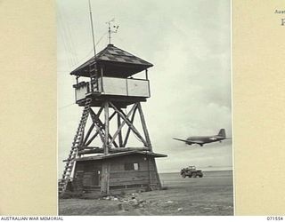 LAE, NEW GUINEA. 1944-03-23. THE CONTROL TOWER ON THE LAE AIRSTRIP WITHIN HEADQUARTERS, LAE BASE SUB-AREA, RE-BUILT AND IN OPERATION FOLLOWING BOMB DAMAGE RECEIVED FROM THE ROYAL AUSTRALIAN AIR ..