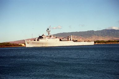 A starboard view of the dock landing ship USS ANCHORAGE (LSD-36) underway in the channel as it departs from the naval station. The ANCHORAGE is en route to its home port of Naval Station, San Diego, Calif., after serving in the Persian Gulf region during Operation Desert Shield and Operation Desert Storm.