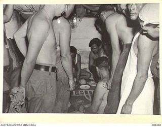 AT SEA. 1945-03-30. THE JAVANESE CREW ABOARD THE VAN HEUTSZ TEACH 2/48 INFANTRY BATTALION, AND 2/11 FIELD AMBULANCE TROOPS TO PLAY "DOODAH" DURING THE MOVEMENT OF HEADQUARTERS 26 INFANTRY BRIGADE ..