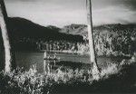 Fishermen in their outrigger canoes, in a bay, near Uturoa