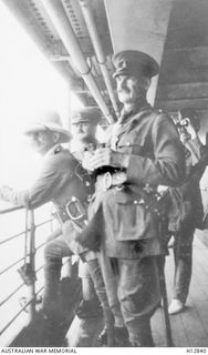 Staff on board HMAT Berrima watching the disembarkment of the Australian Naval and Military Expedition Force at Kabakaul. From left to right: Colonel William Holmes (later Major General CMG DSO ..