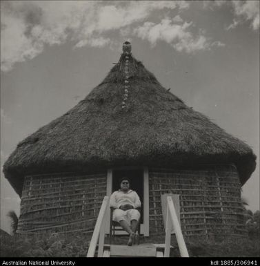 Man in the doorway of a house