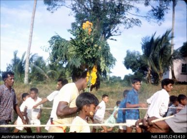 People walking along ropes