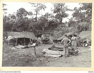 RABAUL, NEW BRITAIN. 1945-09-14. TROOPS OF HEADQUARTERS 11 DIVISION ERECTING A TEMPORARY CAMP IN THE FORMER GOVERNMENT HOUSE AREA. AUSTRALIAN TROOPS OCCUPIED RABAUL AFTER THE JAPANESE SURRENDER AND ..