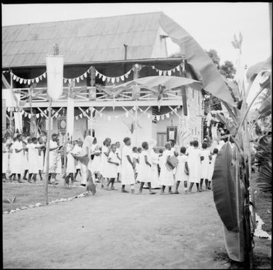 Line of women walking in the Corpus Christi Procession, Vunapope Sacred Heart Mission, Kokopo, New Guinea, 1937 / Sarah Chinnery