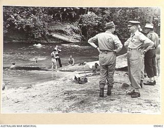 JACQUINOT BAY, NEW BRITAIN. 1945-04-08. ON THE BANKS OF THE WUNUNG RIVER, SENATOR J.M. FRASER, ACTING MINISTER FOR THE ARMY (5); SPEAKS WITH TROOPS OF THE 29/46 INFANTRY BATTALION, 4 BRIGADE, WHO ..