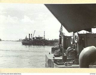 MADANG, NEW GUINEA. 1944. A VIEW OF THE NEW WHARF TAKEN FROM THE DECK OF THE COURIER BARGE OF THE 593RD UNITED STATES BARGE COMPANY