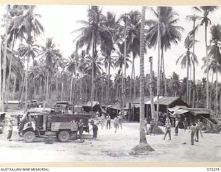 MADANG, NEW GUINEA. 1944-08-15. WORKSHOPS AND CAMP AREA OF THE 165TH GENERAL TRANSPORT COMPANY SHOWING VEHICLES IN FOR OVERHAUL AND REPAIR