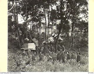 RAMU VALLEY, NEW GUINEA, 1944-03-26. PERSONNEL OF HEADQUARTER, 15TH INFANTRY BRIGADE. SHOWN ARE: VX14737 CAPTAIN G.A. WILLIAMS; VX103267 SERGEANT C.V. NICHOLLS; VX89836 SIGNALMAN C.W. NORMINGTON; ..