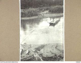 BULLDOG, NEW GUINEA, 1943-09-16. LAKATOI BEING PROPELLED ACROSS THE LAKEKAMU RIVER BY THE FORCE OF THE CURRENT