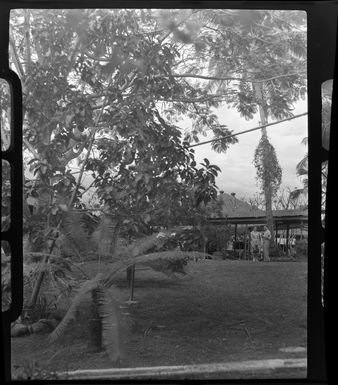 Two unidentified people outside [Northern Hotels], Ba, Fiji