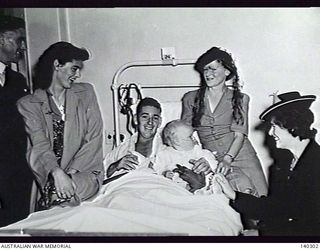 HEIDELBERG, VIC. 1944-01-15. PRIVATE K. B. BRUCE, A WOUNDED SOLDIER RECENTLY EVACUATED FROM NEW GUINEA, RECEIVES A VISIT FROM FRIENDS WHILE IN THE 115TH MILITARY HOSPITAL