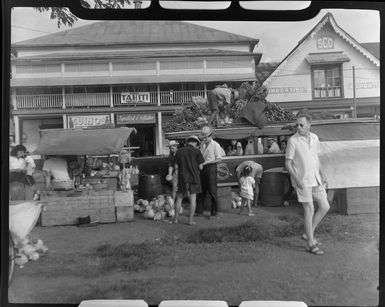 Fruit stall, Papeete, Tahiti, showing locals selling fruit