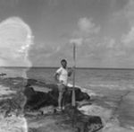 Walter H. Munk with oar during the Capricorn Expedition, Bikini Atoll area