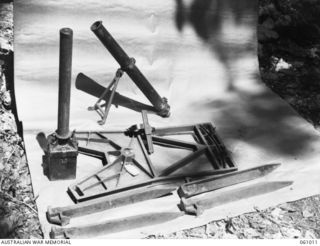 NEW GUINEA. 1943-11-24. DISMANTLED JAPANESE SPIGOT MORTAR (ANTI-TANK). THIS EQUIPMENT HAS BEEN PREPARED FOR DEMONSTRATION PURPOSES BY THE COMMAND ROYAL ENGINEERS HEADQUARTERS, 9TH AUSTRALIAN ..