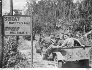 HIRU HIRU, BOUGAINVILLE. 1945-05-16. A ROAD SIGN ERECTED ON THE CORDUROY SECTION OF THE BUIN ROAD, THE MAIN SUPPLY ROUTE FOR TROOPS OF 15 INFANTRY BRIGADE, ADVANCING AGAINST THE JAPANESE SOUTH OF ..