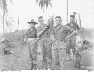 ULUPU, NEW GUINEA, 1945-07-10. BRIGADIER M.J. MOTEN, COMMANDING OFFICER, 17 INFANTRY BRIGADE (1), SPEAKING TO PRIVATE L.T. DONCHI (2), AND PRIVATE D.G. REWELL (3), MEMBER OF 16 PLATOON, D COMPANY, ..