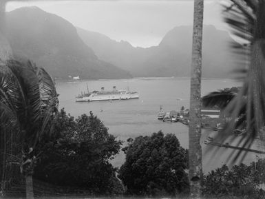 [Large passenger ship in Pacific Island harbour]