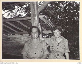 LAE, NEW GUINEA, 1945-05-16. PRIVATE A.E. DAVIS (1), AND PRIVATE L.A. CARTER (2), AUSTRALIAN WOMEN'S ARMY SERVICE PERSONNEL FROM QUARTERMASTER BRANCH, HEADQUARTERS LAE BASE SUB-AREA. THEY ARE ..
