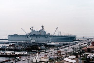 The amphibious assault ship USS SAIPAN (LPH-2), lies tied up at the naval station