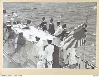 AT SEA OFF RABAUL, NEW BRITAIN. 1945-09-04. JAPANESE NAVAL LAUNCH DRAWING AWAY FROM HMAS VENDETTA, AFTER PRE- SURRENDER DISCUSSIONS ABOARD HMAS VENDETTA AT A SEA RENDEZVOUS OFF RABAUL BETWEEN ..