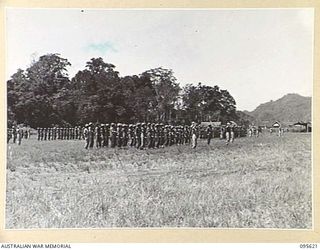 LAE AREA, NEW GUINEA. 1945-09-01. COLONEL J.T. SIMPSON, DEPUTY DIRECTOR OF ORDNANCE SERVICE, INSPECTED A PARADE OF THE ORDNANCE PERSONNEL UNDER HIS COMMAND IN THE LAE AREA, AT 4 ADVANCED ORDNANCE ..