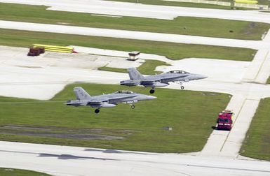 Two US Marine Corps (USMC) F/A-18D Hornets, Marine Fighter Attack Squadron (All Weather)-224 (VMFA(AW)-224), Iwakuni, Japan, take off from Andersen Air Force Base (AFB), Guam, during Exercise COPE NORTH. COPE NORTH is an exercise that includes troops from the US Air Force, US Marines, and US Navy training with troops from the Japanese Air Self Defense Force (JASDF)