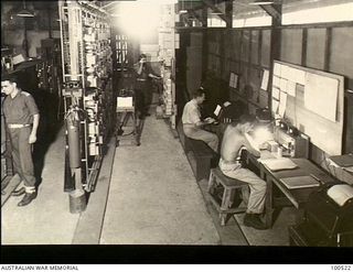 Lae, New Guinea. 1944-06-18. Interior of a section of the Trunk Telephone and Telegraph Carrier Terminal Station, Lae Base Sub Area