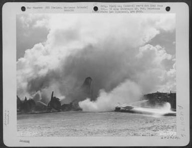 Fire fighters attempt to extinguish a blaze engulfing the wreckage of a Boeing B-29. Saipan Marianas Islands, November 1944 (U.S. Air Force Number 64295AC)