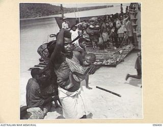 MUSCHU ISLAND, NEW GUINEA, 1945-09-11. FOLLOWING THE SURRENDER OF THE JAPANESE, MUSCHU ISLAND IS NOW UNDER THE CONTROL OF HQ 6 DIVISION AND THE ISLAND NATIVES ARE BEING EVACUATED TO NEW GUINEA FOR ..