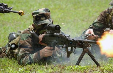 US Army (USA) Private First Class (PFC) Joshua McComas, 2nd Battalion, 27th Infantry Regiment (2/27) Charlie Company, 25th Infantry Division (ID) [Light], Schofield Barracks, Hawaii (HI), performs a test fire, using M82 blanks, to make sure his weapon is functioning properly before going on his mission during Exercise TANDEM THRUST 2003