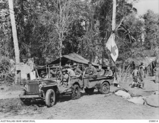 DUMPU, NEW GUINEA. 1943-10-15. A JEEP LOADED WITH WALKING WOUNDED AND MALARIA CASES, LEAVING THE 2/6TH AUSTRALIAN FIELD AMBULANCE FOR THE AIRSTRIP FOR EVACUATION TO AN AUSTRALIAN GENERAL HOSPITAL ..